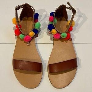 Tan sandals with Pom Pom details